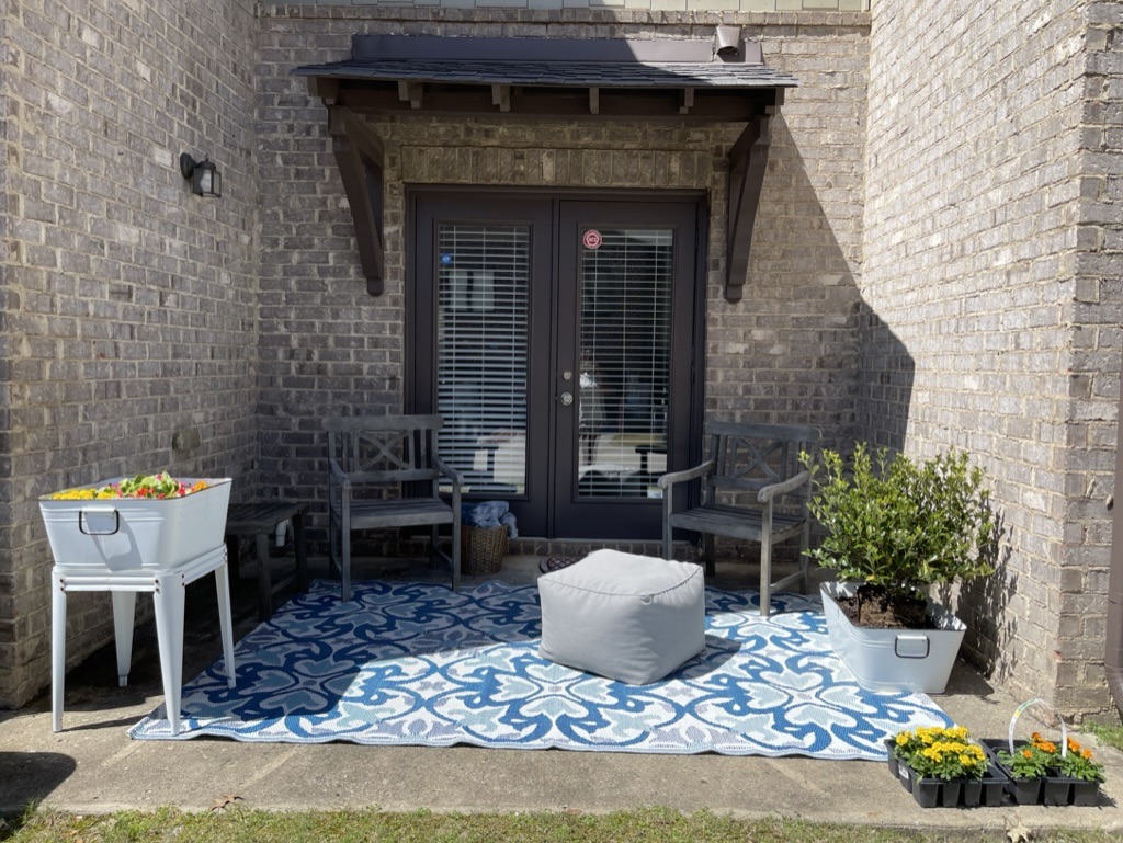 Patio view with seating outdoor rug